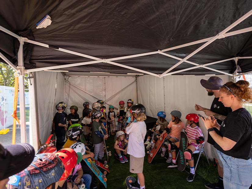Group of young skateboarders waiting in tent before competition at Moomba festival